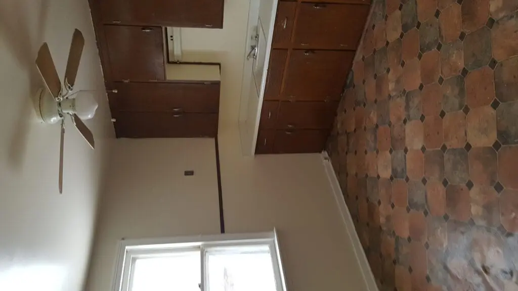 Small kitchen with terracotta tile floor