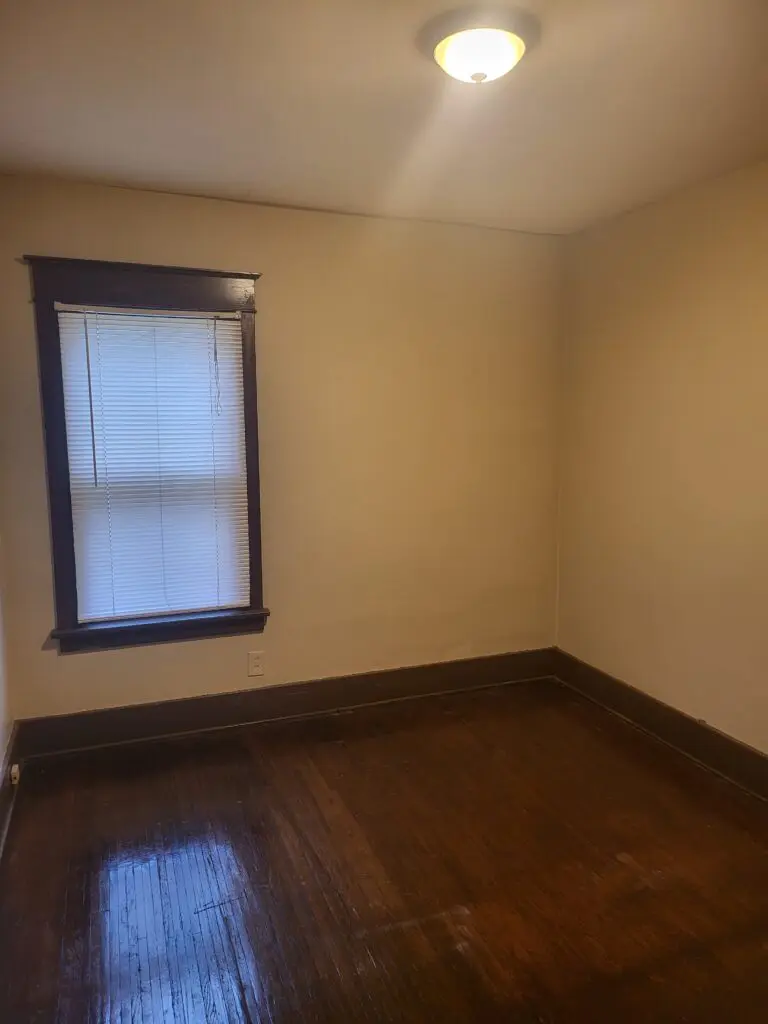 Empty bedroom showcasing warm tones