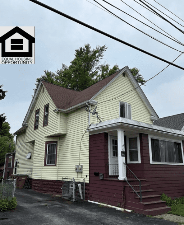Two-story house with Equal Housing Opportunity logo.